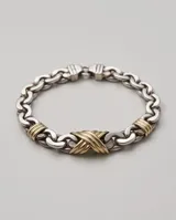 Pulsera de eslabones de plata 925 con diseño trenzado y detalles entrelazados en lámina de oro de 18k en el centro.
