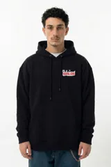Hoodie negro de corte oversize con capucha amplia. Presenta un estampado gráfico colorido en la espalda con el texto 'Vernal Club' y una ilustración de estilo underground.