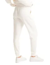 Jogger deportivo de corte holgado, con cintura elástica y lazo de ajuste, bolsillos laterales y puños elásticos en los tobillos.