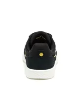 Sneaker Caterpillar modelo Pause Retro T-Toe para mujer, en color negro con detalles dorados y suela blanca. Fabricadas en cuero gamuzado, cuentan con plantilla de espuma EVA y suela de goma duradera.