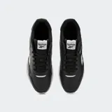 Championes Reebok modelo Jogger Lite, color negro con detalles en blanco y suela blanca, de diseño clásico y deportivo.