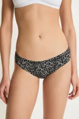 Bombacha tipo culotte de tiro medio con estampado de puntos blancos sobre fondo negro. Confeccionada en poliamida y elastano con forro de algodón.