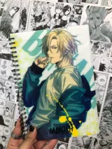 Cuaderno tamaño A5 con tapas plásticas y diseño de Ash Lynx del anime Banana Fish. Contiene 80 hojas rayadas.