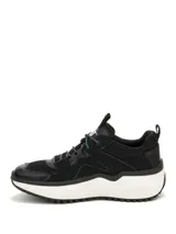 Sneakers Caterpillar modelo Hasten Mesh de color negro con detalles en blanco y violeta, con suela chunky blanca y cordones ajustables.