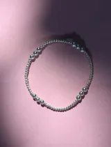 Pulsera elástica de cuentas de 2 y 4 mm en oro laminado 14 Kilates (Goldfilled).