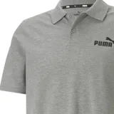 Remera polo Puma de hombre, color gris melange, con cuello y puños acanalados, cierre frontal de botones y logo de la marca estampado en el pecho.