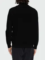 Cardigan de punto negro Moncler, de corte recto, con cuello alto, cierre frontal completo con cremallera y mangas largas.