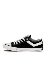 Championes deportivos Pony modelo GM 877 de lona blanca, con cordones y suela de goma con líneas decorativas en rojo y negro.