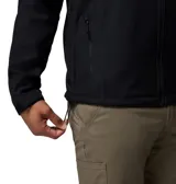 Chaqueta softshell Columbia con capucha desmontable, cierre frontal completo, bolsillo con cremallera en el pecho y bolsillos laterales. Cuenta con tecnología resistente al agua y puños ajustables.