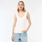 Musculosa de canalé color blanco, de corte ajustado con escote redondo.