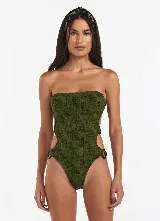 Bañador enterizo color verde militar, tejido jacquard, escote recto con detalle de anillos de resina en los laterales y espalda anudada.