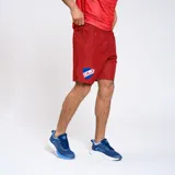 Bermuda deportiva azul marino con escudo del Club Nacional de Football y logo de Umbro.