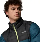 Campera puffer Columbia modelo Powder Lite II, diseño en bloque de color con la parte superior negra y la inferior en verde oscuro, con cierre frontal y detalles en verde lima brillante.