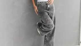 Pantalón de jean gris con efecto lavado, corte recto y tiro alto.