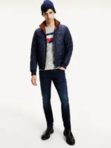 Jeans slim de Tommy Hilfiger confeccionados en denim elástico de mezcla de algodón, con diseño clásico de cinco bolsillos y lavado oscuro.