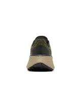 Championes de trail running Columbia modelo Konos Trillium, color verde oliva con entresuela beige y detalles en negro y naranja. Presenta malla transpirable con refuerzos, sistema de ajuste Navic Fit y suela Adapt Trax de alta tracción.
