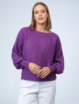 Buzo marca Cupio de tejido acanalado color azul. Tiene mangas largas estilo dolman y aplique de botones en la espalda.