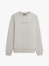 Buzo de cuello redondo Tommy Hilfiger, color gris melange, con diseño clásico y detalles acanalados en cuello, puños y bajo. Cuenta con un pequeño logo gráfico estampado y bordado en el centro del pecho.
