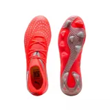 Championes de fútbol Puma Future 9 Match FG/AG, color naranja vibrante con detalles en plateado. Diseño de corte medio con tecnología de ajuste avanzado y suela especializada para tracción en césped natural y artificial.
