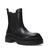 Botas Chelsea de mujer, color negro, con caña media y elásticos laterales. Suela plataforma gruesa y dentada.