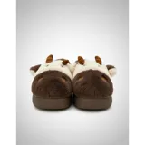Pantuflas de peluche con diseño de vaca, confeccionadas en piel sintética suave. Cuentan con suela de goma antideslizante y diseño abierto en el talón.