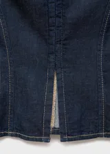 Top sin mangas estilo chaleco confeccionado en tejido de algodón y lino, con cuello solapa, cierre frontal con cremallera y costuras en contraste.