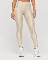 Calza deportiva de talle alto color beige metalizado, con diseño anatómico y bolsillo lateral.