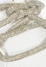 Championes deportivos Schutz de color blanco, confeccionados en tejido de punto con suela de goma a tono. Presentan un diseño moderno con cordones decorativos de lurex brillante y detalle de marca en la lengüeta.