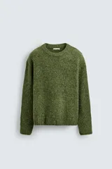 Jersey de punto con estructura de torzal y efecto jaspeado, de corte relajado, cuello redondo y manga larga con acabados en rib.