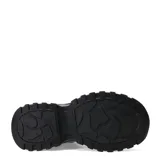 Championes blancos con plataforma alta y suela con diseño irregular.