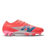 Championes de fútbol New Balance Furon V8, color coral con detalles en plateado y azul.