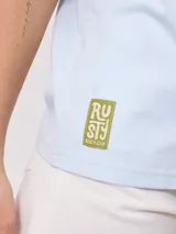 Remera blanca de algodón con estampado frontal y trasero con la leyenda "Rusty Australia Mermaid Beach". Corte holgado.