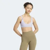 Top deportivo Adidas Optime Workout Twist Reversible de color lila, con diseño de doble tirante y cuello redondo.