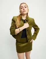 Pulsera rígida plateada con dos cristales grises en los extremos.