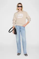 Buzo estilo collegiate de corte shrunken, confeccionado en algodón fleece. Presenta cuello redondo, puños y ruedo acanalados, paneles laterales acanalados y estampa frontal con la inscripción PARIS ANINE BING.