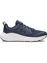 Championes de entrenamiento Under Armour modelo Charged Commit TR 4, color azul marino con detalles en negro y suela blanca. Presentan parte superior de malla transpirable con refuerzos laterales texturizados y logo de la marca en el costado.