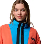 Campera polar Columbia de la colección Icons, con diseño color block en tonos naranja, azul y negro. Presenta cierre frontal completo, cuello alto, bolsillos laterales con cierre y detalles en nailon en el pecho.