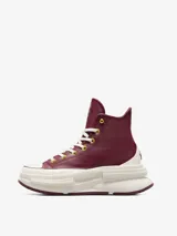 Championes Converse Run Star Legacy CX HI de caña alta, color borgoña con detalles en dorado y blanco. Confeccionados en cuero con plataforma chunky y suela de goma.