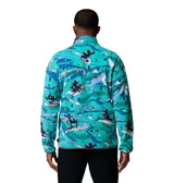 Buzo polar de media cremallera Columbia edición especial Disney, con estampado colorido de Mickey Mouse esquiando sobre fondo turquesa. Presenta cuello alto con cierre a presión, bolsillo frontal con cremallera y ribetes elásticos en puños y dobladillo.