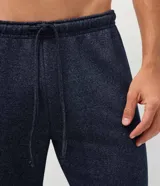 Pantalón jogger de pijama color azul marino melange, confeccionado en mezcla de algodón y poliéster, con cintura elástica y cordón ajustable.