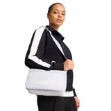 Cartera bandolera Puma de diseño deportivo, color gris claro con logo de la marca estampado en blanco. Cuenta con cierre superior, correa ajustable para llevar al hombro o cruzada y compartimento principal compacto.