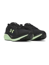 Championes de running Under Armour modelo Assert 11, color negro con detalles en verde lima en la mediasuela y el logo lateral. Presentan una parte superior de malla transpirable con revestimientos de cuero y amortiguación Charged+ en la mediasuela.