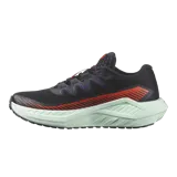 Championes de trail running Salomon DRX Defy Grvl, color negro con detalles en naranja y entresuela verde menta, diseñados con soporte y ligereza para correr en caminos de grava y asfalto.