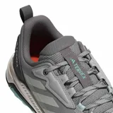 Championes de trail running Adidas Terrex Anylander, color gris con detalles en turquesa y suela en tono beige. Presentan diseño técnico con refuerzos en la puntera y talón, cordones ajustables y logo Terrex en la lengüeta y lateral.