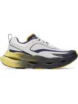 Championes de running Under Armour modelo Halo Racer, con diseño técnico en colores blanco, azul marino y amarillo. Presentan una entresuela con tecnología HOVR+ de gran amortiguación y geometría de balancín, parte superior de malla transpirable y suela de goma duradera para mayor tracción.