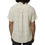 Camisa de manga corta color beige con estampado a cuadros negros, cuello clásico y bolsillo en el pecho.