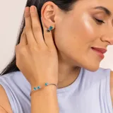 Brazalete abierto de plata 925 con piedras de topacio azul y jade negro azul.