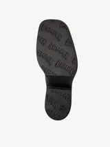 Zueco negro de piel vacuna con plataforma y tacón de 6,8 cm. Cuenta con plantilla reciclada OrthoLite y suela de EVA para mayor ligereza y confort.