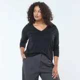 Camiseta de punto negra con cuello en V y mangas largas, de corte recto y holgado.