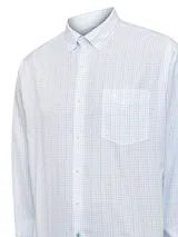 Camisa de manga larga RKF con estampado de cuadros finos en tonos azul y negro sobre fondo blanco. Presenta cuello americano abotonado, cierre frontal con botones, puños con doble botón y bolsillo en el pecho con el logo de la marca bordado.
